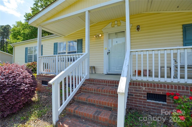 entrance to property with covered porch