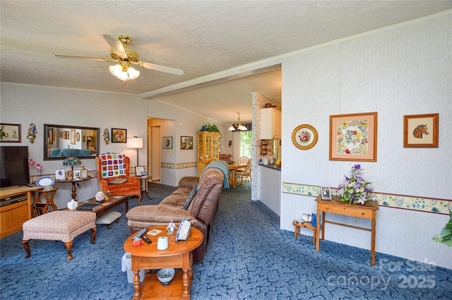 living room featuring lofted ceiling, a textured ceiling, carpet, crown molding, and ceiling fan
