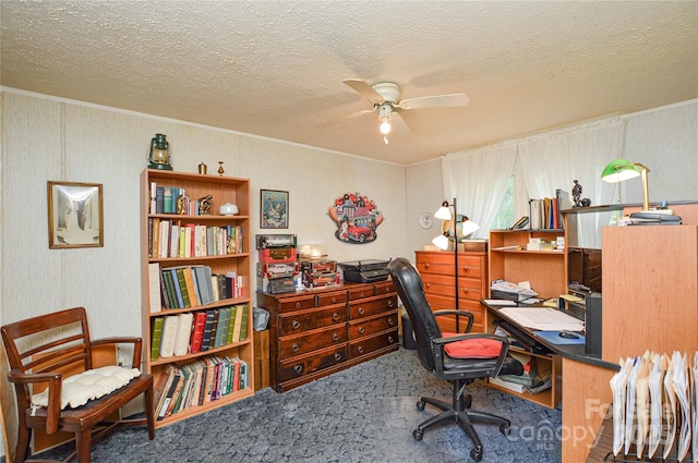 office space featuring a textured ceiling, ornamental molding, ceiling fan, and carpet floors