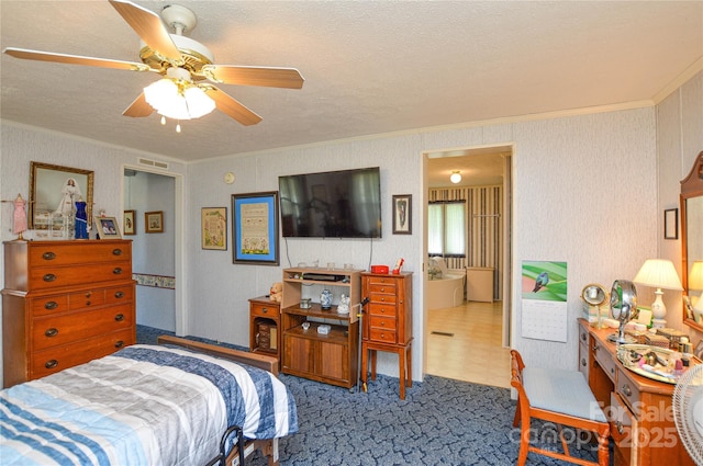 bedroom with a textured ceiling, carpet flooring, ceiling fan, visible vents, and crown molding