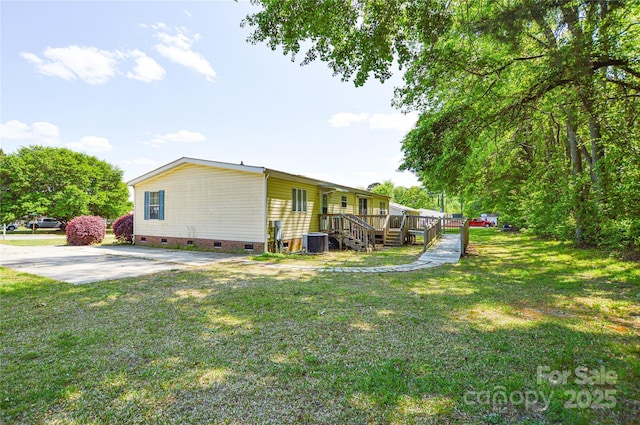 view of property exterior featuring central AC unit, a deck, a lawn, and crawl space