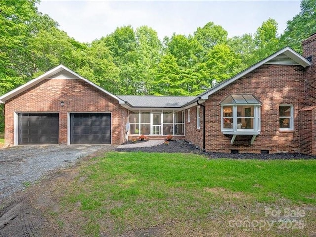 300 Hugh Crocker Rd, Matthews, NC 28104 - ranch-style home with brick siding, a garage, a sunroom, a front lawn, and asphalt driveway