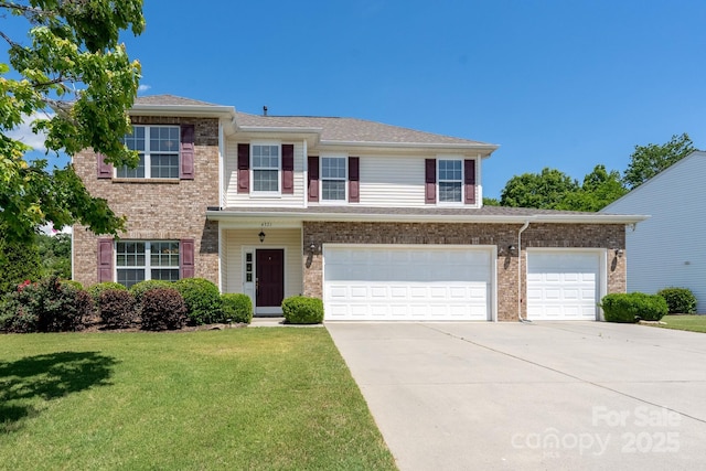4321 Tucker Chase Dr, Midland, NC 28107 - traditional-style home featuring concrete driveway, a front yard, brick siding, and an attached garage