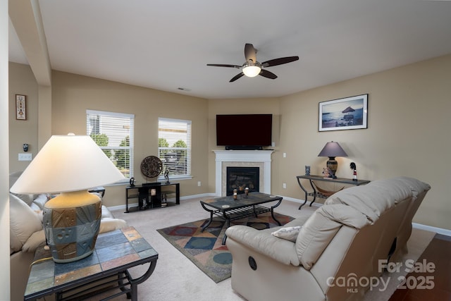 4321 Tucker Chase Dr, Midland, NC 28107 - carpeted living area with baseboards, visible vents, a glass covered fireplace, and ceiling fan