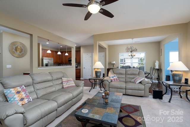 4321 Tucker Chase Dr, Midland, NC 28107 - living room featuring light colored carpet and ceiling fan with notable chandelier
