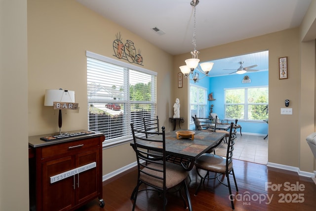 4321 Tucker Chase Dr, Midland, NC 28107 - dining area featuring baseboards, an inviting chandelier, visible vents, and dark wood-style floors