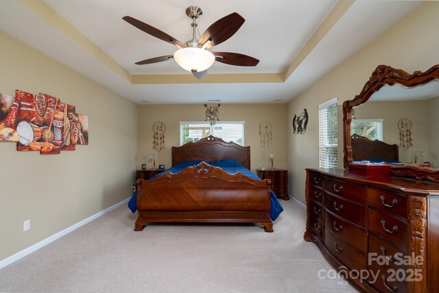 4321 Tucker Chase Dr, Midland, NC 28107 - bedroom with a ceiling fan, a raised ceiling, light carpet, and baseboards