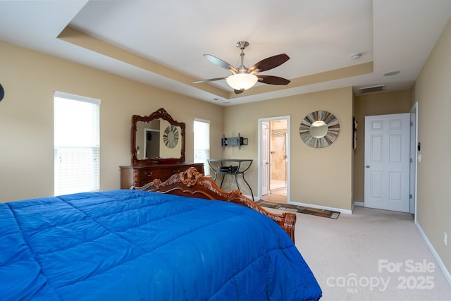4321 Tucker Chase Dr, Midland, NC 28107 - bedroom with visible vents, ceiling fan, light carpet, a tray ceiling, and baseboards