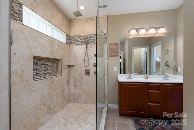 4321 Tucker Chase Dr, Midland, NC 28107 - bathroom featuring a tile shower, tile patterned flooring, visible vents, and a sink