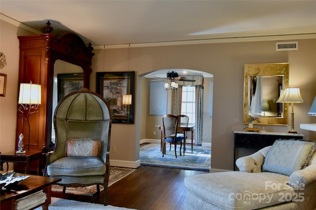 185 Macon Ave Unit 9B, Asheville, NC 28804 - living area with arched walkways, dark wood-style flooring, crown molding, baseboards, and ceiling fan