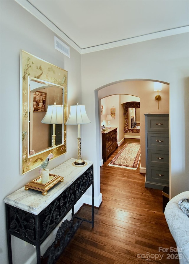 185 Macon Ave Unit 9B, Asheville, NC 28804 - hallway with ornamental molding, arched walkways, wood finished floors, and baseboards