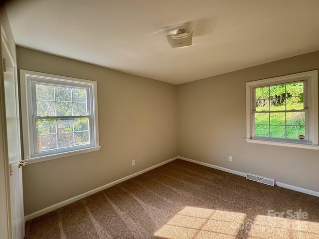 2020 Longleaf Dr, Charlotte, NC 28210 - unfurnished room with healthy amount of natural light and dark carpet