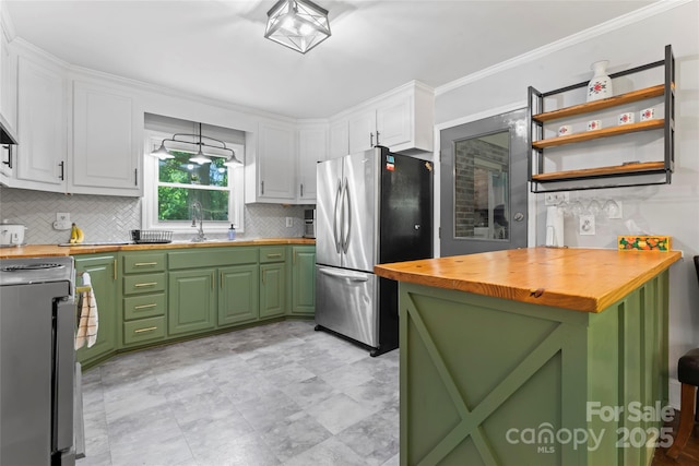 851 Gist Rd, Rock Hill, SC 29732 - kitchen featuring wood counters, freestanding refrigerator, stove, green cabinets, and white cabinetry