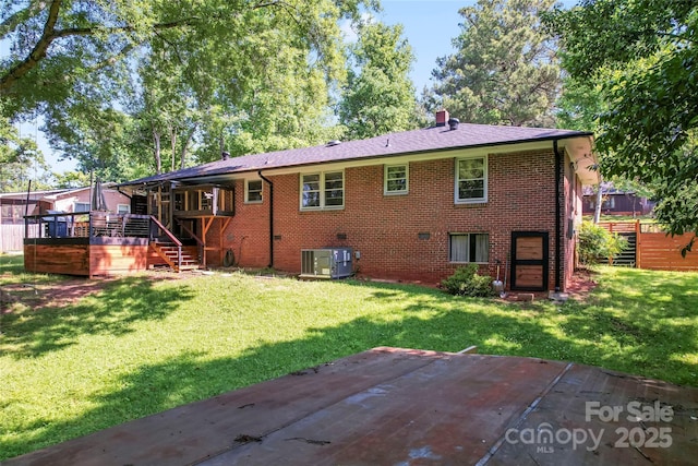 851 Gist Rd, Rock Hill, SC 29732 - back of house with stairs, central air condition unit, brick siding, a chimney, and a yard