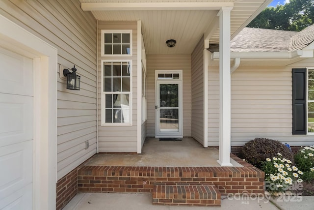 12013 Regent Ridge Ln, Charlotte, NC 28278 - view of exterior entry with covered porch and roof with shingles
