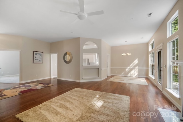 12013 Regent Ridge Ln, Charlotte, NC 28278 - unfurnished living room with dark wood-style floors, baseboards, a chandelier, and ceiling fan
