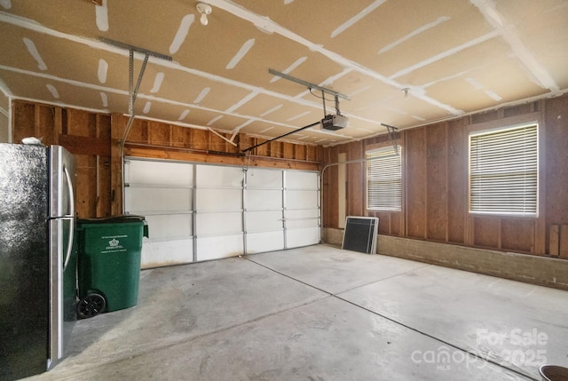 12013 Regent Ridge Ln, Charlotte, NC 28278 - garage with freestanding refrigerator and a garage door opener