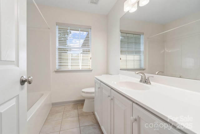 12013 Regent Ridge Ln, Charlotte, NC 28278 - full bathroom with toilet, tile patterned flooring, vanity, and baseboards