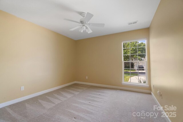 12013 Regent Ridge Ln, Charlotte, NC 28278 - unfurnished room featuring light colored carpet, a ceiling fan, and baseboards