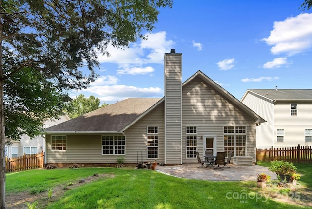12013 Regent Ridge Ln, Charlotte, NC 28278 - rear view of property featuring a patio area, a chimney, and roof with shingles