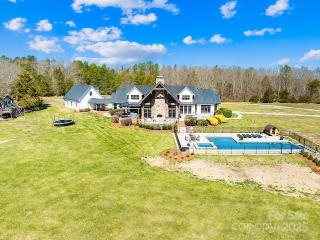 12613B Oak Grove Rd, Stanfield, NC 28163 - rear view of property with a chimney, a forest view, and metal roof