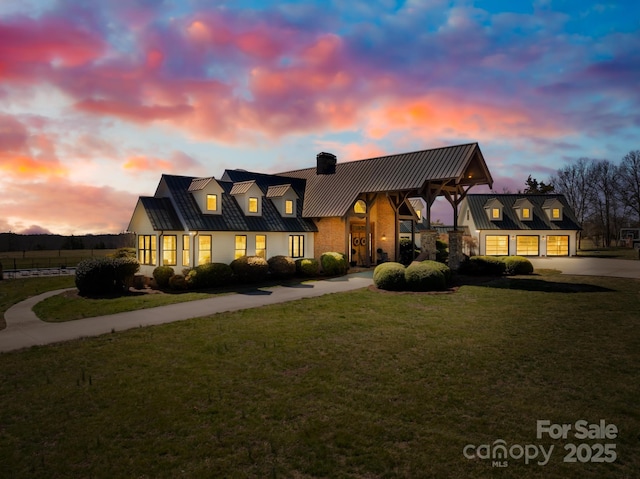 12613B Oak Grove Rd, Stanfield, NC 28163 - new england style home featuring a chimney, a front lawn, concrete driveway, metal roof, and a standing seam roof