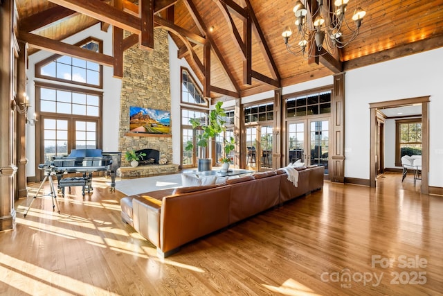 12613B Oak Grove Rd, Stanfield, NC 28163 - living area featuring high vaulted ceiling, hardwood / wood-style floors, wooden ceiling, a fireplace, and beamed ceiling