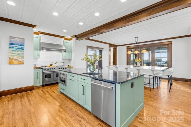 12613B Oak Grove Rd, Stanfield, NC 28163 - kitchen with stainless steel appliances, green cabinetry, crown molding, a sink, and baseboards