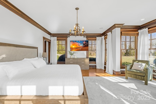 12613B Oak Grove Rd, Stanfield, NC 28163 - bedroom with a chandelier, ornamental molding, and wood finished floors
