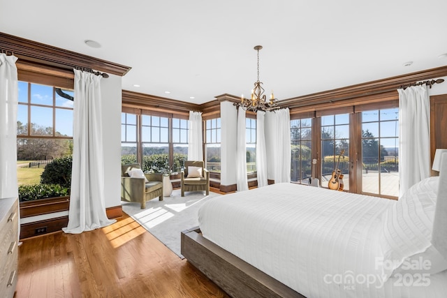 12613B Oak Grove Rd, Stanfield, NC 28163 - bedroom with a chandelier, multiple windows, wood finished floors, crown molding, and recessed lighting