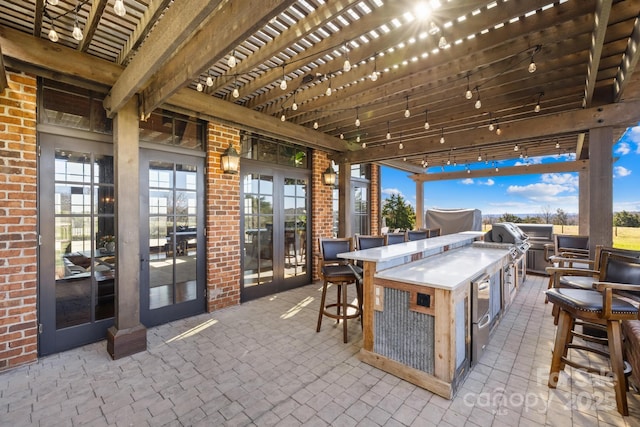 12613B Oak Grove Rd, Stanfield, NC 28163 - view of patio featuring an outdoor kitchen and a pergola