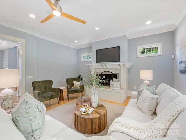 3825 Mountain Cove Dr, Charlotte, NC 28216 - living area featuring healthy amount of natural light, wood finished floors, crown molding, recessed lighting, and a fireplace
