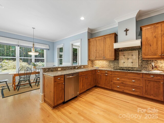 3825 Mountain Cove Dr, Charlotte, NC 28216 - kitchen with dishwasher, brown cabinets, light wood-type flooring, black electric stovetop, and crown molding