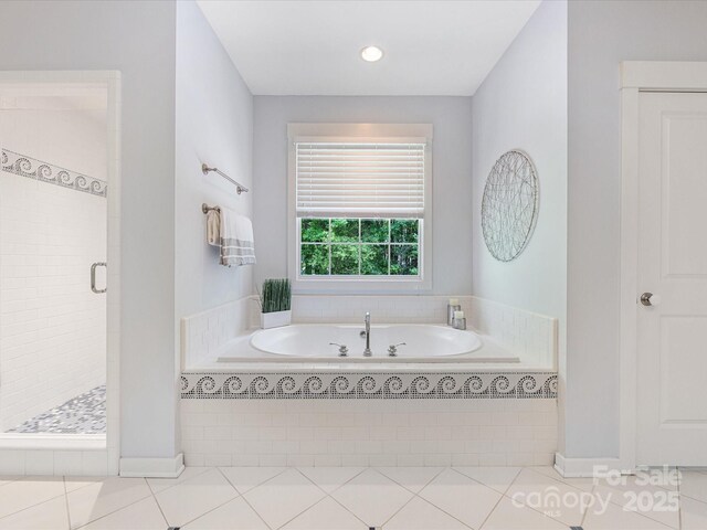 3825 Mountain Cove Dr, Charlotte, NC 28216 - bathroom featuring a stall shower, a bath, tile patterned floors, and recessed lighting