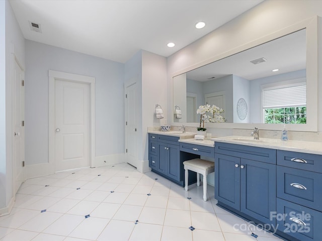 3825 Mountain Cove Dr, Charlotte, NC 28216 - bathroom featuring double vanity, baseboards, and recessed lighting