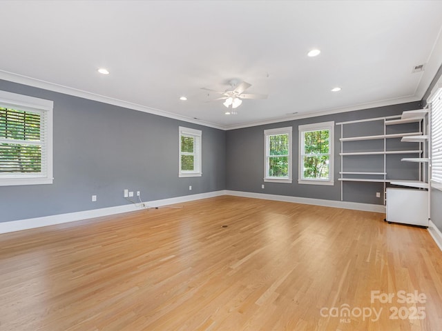 3825 Mountain Cove Dr, Charlotte, NC 28216 - unfurnished room featuring ornamental molding, ceiling fan, light wood-type flooring, plenty of natural light, and baseboards
