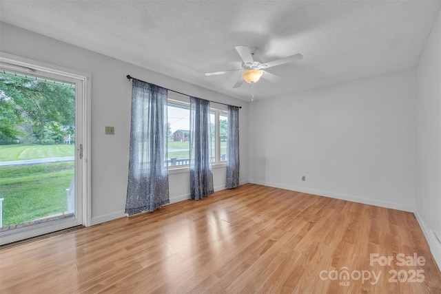 133 Jo Monni Loop, Statesville, NC 28625 - unfurnished room featuring light wood-type flooring, a ceiling fan, a textured ceiling, and baseboards