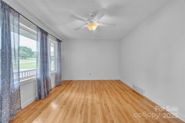 133 Jo Monni Loop, Statesville, NC 28625 - spare room with wood finished floors, baseboards, and a ceiling fan