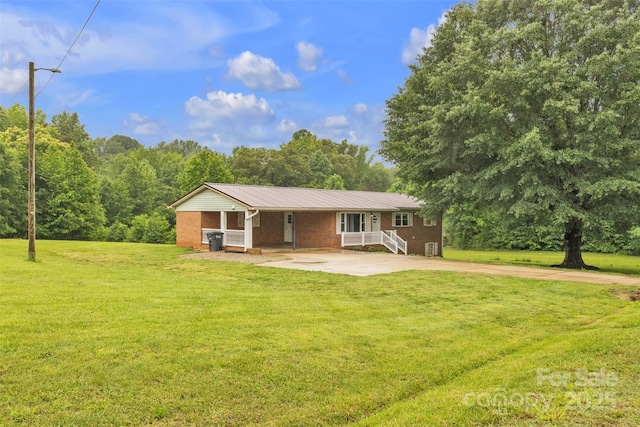 133 Jo Monni Loop, Statesville, NC 28625 - ranch-style house featuring brick siding, a front lawn, metal roof, and driveway
