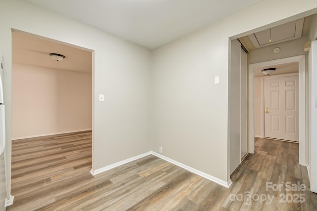 7129 Stonington Ln, Charlotte, NC 28227 - hall with attic access, wood finished floors, and baseboards
