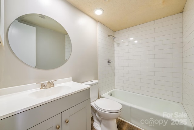 7129 Stonington Ln, Charlotte, NC 28227 - bathroom with toilet, wood finished floors, vanity, washtub / shower combination, and a textured ceiling