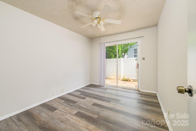7129 Stonington Ln, Charlotte, NC 28227 - empty room featuring a textured ceiling, wood finished floors, a ceiling fan, and baseboards