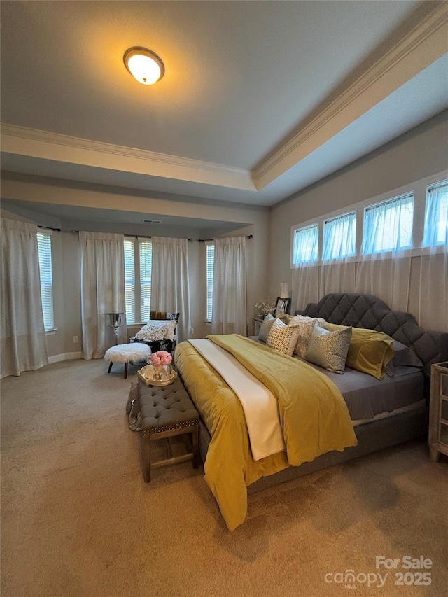 bedroom with crown molding, multiple windows, and carpet