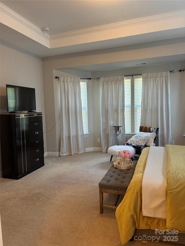 bedroom with baseboards, carpet flooring, visible vents, and crown molding