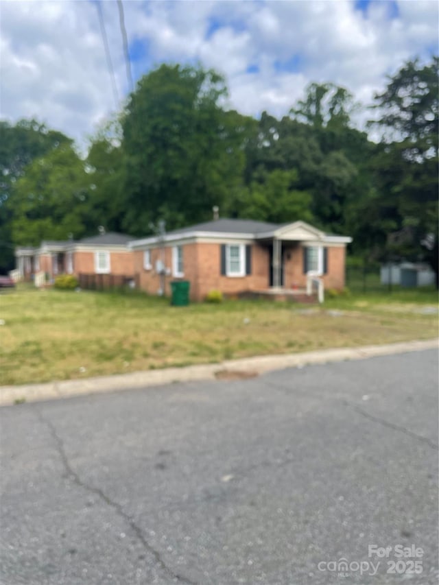 1902 Catherine Simmons Ave Unit 30, Charlotte, NC 28216 - single story home featuring a chimney and a front yard