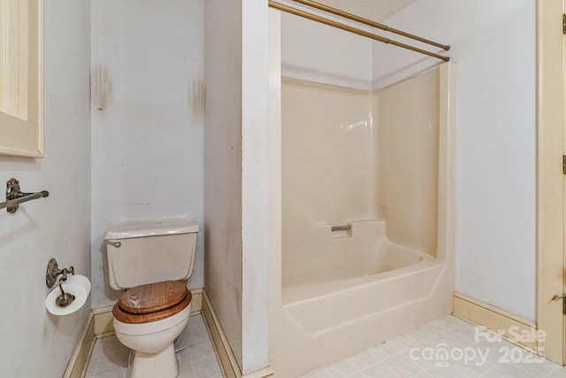 full bath with tile patterned floors, toilet, and baseboards