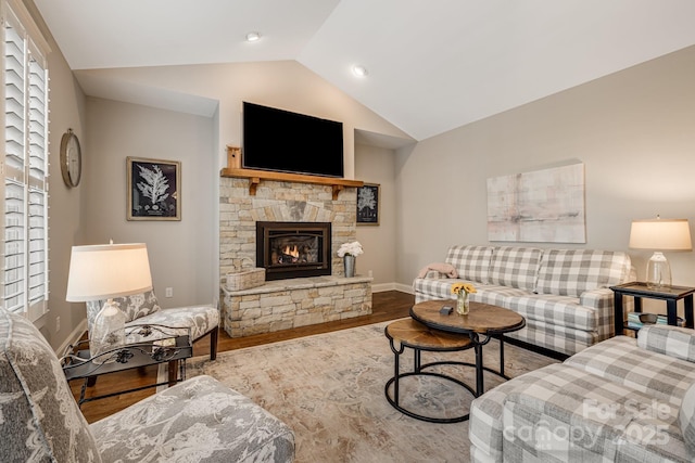 75 Balsam High Rd, Biltmore Lake, NC 28715 - living area featuring vaulted ceiling, a fireplace, wood finished floors, and baseboards