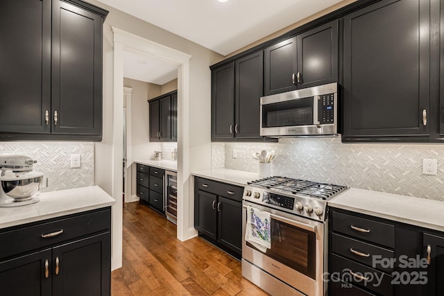 75 Balsam High Rd, Biltmore Lake, NC 28715 - kitchen with stainless steel appliances, beverage cooler, backsplash, and dark cabinets
