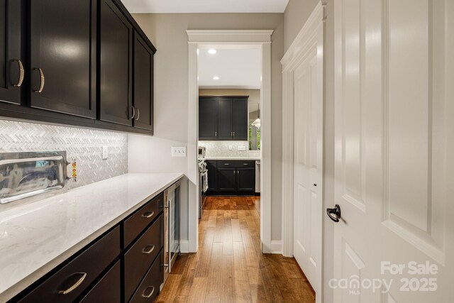 75 Balsam High Rd, Biltmore Lake, NC 28715 - bar area with dark wood-style flooring, tasteful backsplash, wine cooler, and recessed lighting