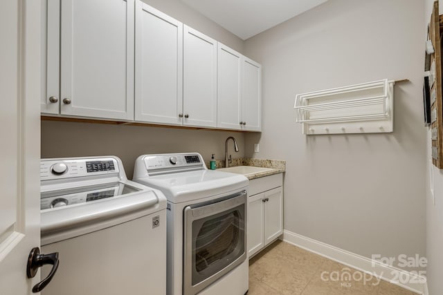 75 Balsam High Rd, Biltmore Lake, NC 28715 - clothes washing area featuring separate washer and dryer, cabinet space, and baseboards